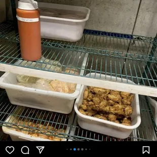 two trays of food on a shelf