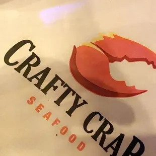 a paper bag with a crab on it