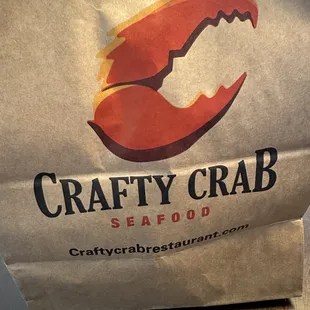 a paper bag with a crab on it