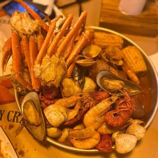 a bowl of seafood and corn