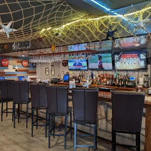 The bar with some TVs.