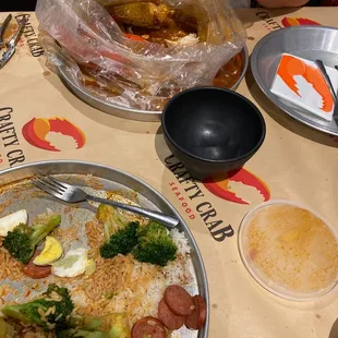 Snow Crab Legs platter with a side of broccoli, 1/2lb of sausage and rice... AFTERMATH