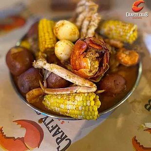 a bowl of seafood and corn