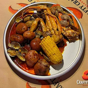a plate of seafood and corn