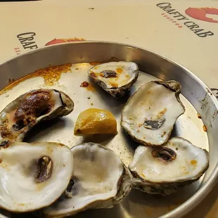 What&apos;s left of the steamed oysters with a piece of lemon in the middle
