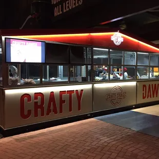 The stand is located just past the 1st base entrance to the stadium.