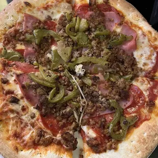 Meat lovers personal pie with green peppers