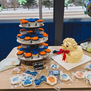 Custom duck cake and cupcakes.