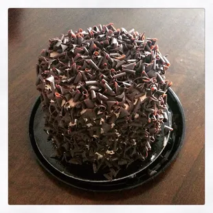 Chocolate mini cake. Chocolate cake, chocolate mousse, chocolate shavings.