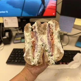 Tomato, cucumber, & onion with chive cream cheese on a wheat bagel