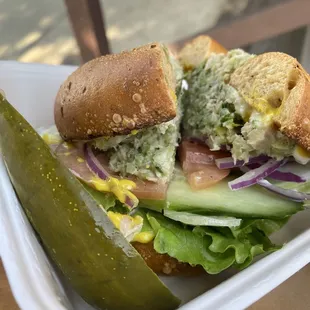Bagel with Tuna and pickle spear
