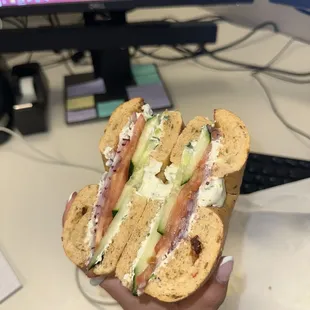 Tomato, cucumber, & onion with chive cream cheese on a sundried tomato bagel