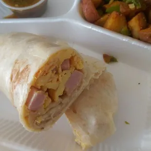 Breakfast Burrito (ham, tomato, cheese) - amazing! Perfectly sized &amp; delicious. Served with tasty potatoes O&apos;Brien and a great fresh salsa.