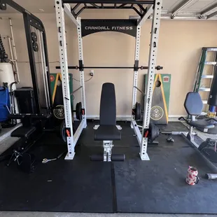 Squat machine  / lay pulldown machine all the accessories with it  /Olympic bar / curl bar / bench