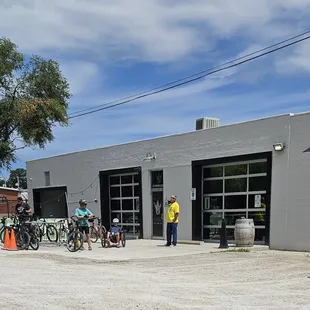 a group of people standing in front of a building
