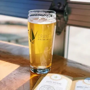 a glass of beer on a table