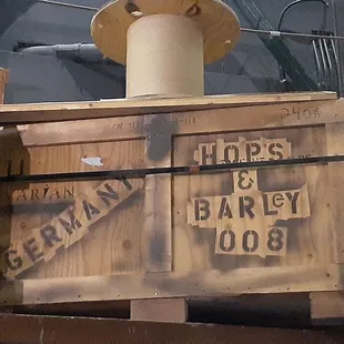 a wooden crate with a sign on it