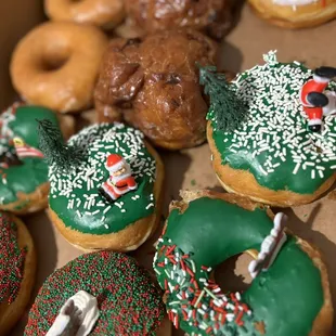 Holiday special donuts and apple donuts, classic glaze, vanilla sprinkle.