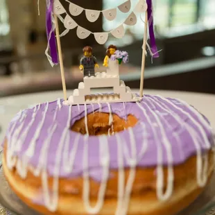 a wedding cake with purple icing