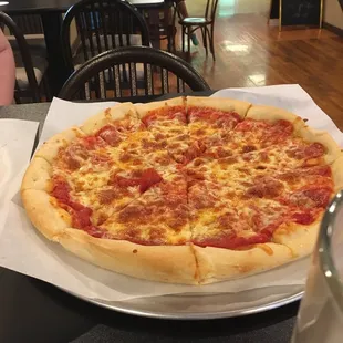 a pepperoni pizza on a plate