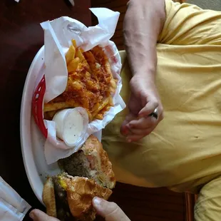 a man holding a plate of food