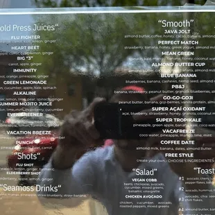 a man taking a picture of the menu