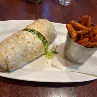 Chicken Caesar Wrap with sweet potato fries. Underwhelming all around.