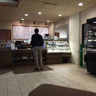 a man standing in front of the counter
