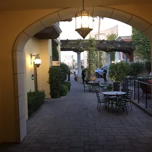 an archway leading to a patio