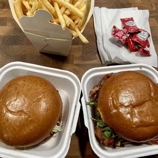 two burgers and fries to go