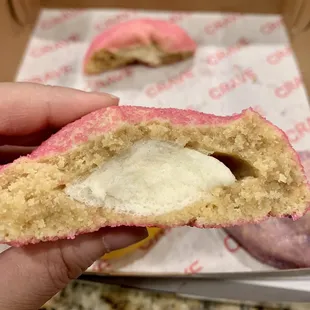 a half eaten doughnut with a bite taken out of it