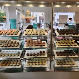 a variety of cupcakes on display