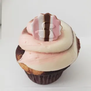 a cupcake with pink frosting