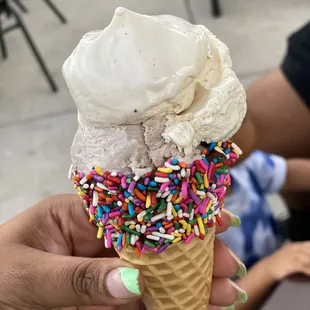 Sprinkle Cone Double Scoop with cookie dough and cookies and Cream! Add the Malt ball to keep the cone from running.