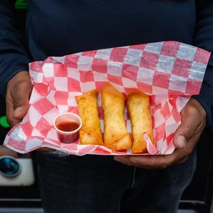 a person holding a basket of food