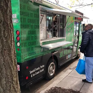 a food truck parked on the side of the street