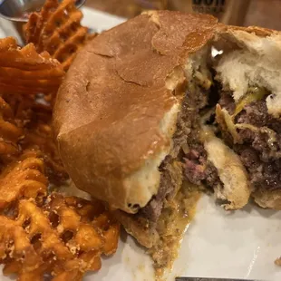 Smash burger with sweet potato fries and an apple crisp cocktail