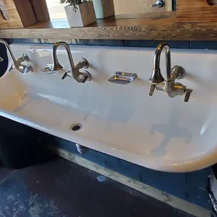 a sink with five faucets