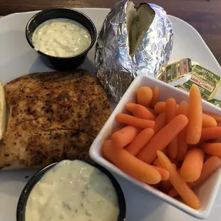 Grilled salmon dinner with baked potato