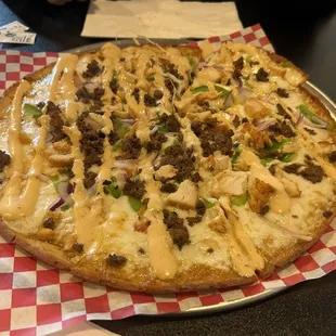 a pizza with cheese and meat on it