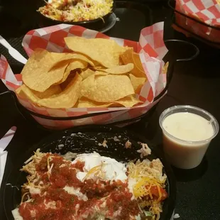 Chicken bowl with cheese, queso, sour cream and mild taco sauce.