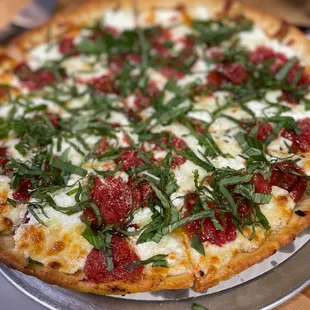  pizza with cheese, basil, and tomatoes