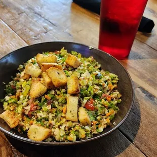  bowl of food on a wooden table