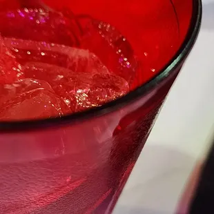  red glass with ice in it