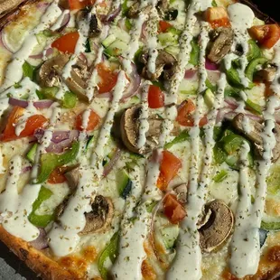 a pizza with vegetables and cheese