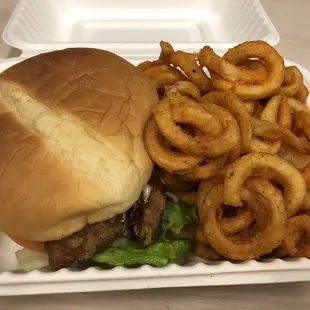 a burger with onion rings
