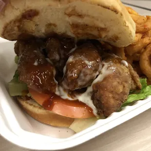 a chicken sandwich and onion rings