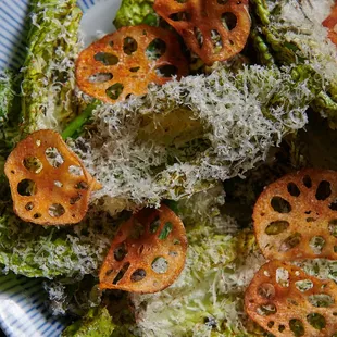 Little Gem Caesar Salad with koji,snap peas, spicy lotus chips