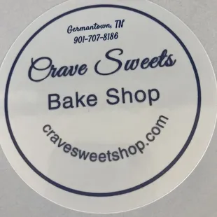 sticker on top of box of sweet treats (website address and phone number)