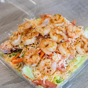 a salad in a plastic container